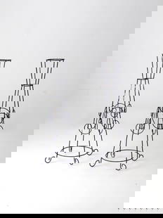 Elegant Pair of Mid Century Black Iron Plant Stands: Elegant Pair of Mid Century Black Iron Plant Stands This pair of mid 20th century plant stands is crafted from black iron, showcasing elegant curling and curving designs. Each stand features a ring to