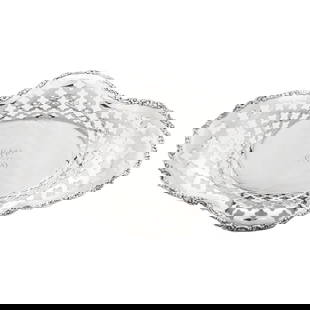 Sterling Silver Oval Dish: Sterling Silver Oval Dish This exquisite sterling silver dish, crafted by the esteemed Tiffany & Company, showcases a stunning reticulated oval design with a fluted rim and scalloped edge. Elevated on
