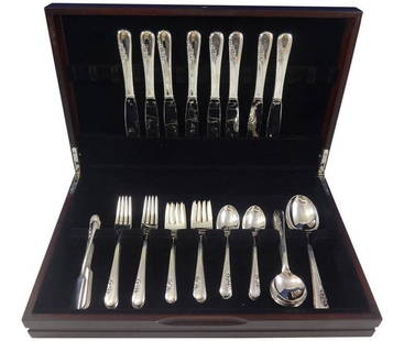 International Silver Blossom Time 50-Piece Flatware Set with Storage Chest: International Silver Blossom Time 50-Piece Flatware Set with Storage Chest This exquisite Blossom Time flatware service is crafted by International Sterling, featuring a post-1940 design that adds ele