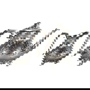 Antique C1890 Silver Plated Tea Set 2 Piece with Foliate Engraving: Antique C1890 Silver Plated Tea Set 2 Piece with Foliate Engraving This exquisite two-piece antique footed tea set, crafted from silver plate, dates back to c1890 and showcases beautiful foliate engra