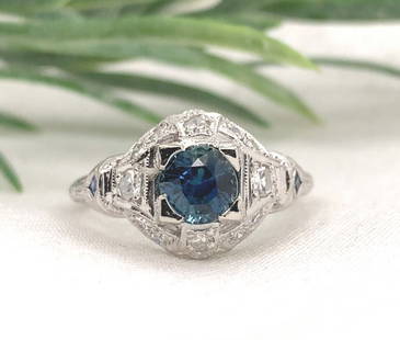 Art Deco Platinum Ring 1.04ct Blue Sapphire and Diamond GIA Certified: Art Deco Platinum Ring 1.04ct Blue Sapphire and Diamond GIA Certified This exquisite Art Deco platinum ring showcases a stunning 1.04 carat genuine blue sapphire at its center, cut in a brilliant roun
