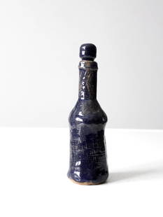 Signed Bill Stoudt Vintage Studio Pottery Bottle Indigo Blue Glaze 8.25": Signed Bill Stoudt Vintage Studio Pottery Bottle Indigo Blue Glaze 8.25" This is a vintage studio pottery bottle circa 1970s. Signed by the artist, Bill Stoudt, the hand-crafted bottle has an indigo b