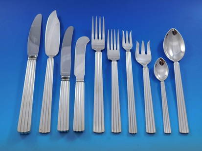 Georg Jensen Bernadotte Sterling Silver Flatware Set 135 pcs with Storage Chest: Georg Jensen Bernadotte Sterling Silver Flatware Set 135 pcs with Storage Chest Experience the elegance of dining with the Bernadotte flatware set by Georg Jensen, a remarkable collection that showcas