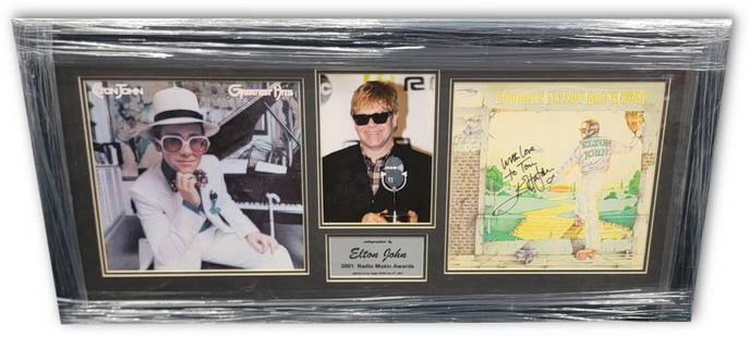 Elton John Signed Framed Yellow Brick Road Album JSA Certified: Elton John Signed Framed Yellow Brick Road Album JSA Certified This is an original Elton John hand-signed autographed album featuring the iconic 'Yellow Brick Road' record. The album is custom framed