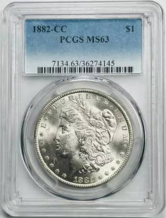 1882 CC Morgan Silver Dollar PCGS MS 63 Uncirculated Chipped Holder: 1882 CC Morgan Silver Dollar PCGS MS 63 Uncirculated Chipped Holder This 1882 CC Morgan Silver Dollar is a stunning piece of numismatic history, graded MS 63 by PCGS, ensuring its quality and authenti