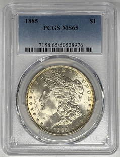 1885 Morgan Silver Dollar PCGS MS 65 Uncirculated Silver Coin: 1885 Morgan Silver Dollar PCGS MS 65 Uncirculated Silver Coin This 1885 Morgan Silver Dollar is a stunning example of American coinage. Graded MS 65 by PCGS, it showcases exceptional detail and luster