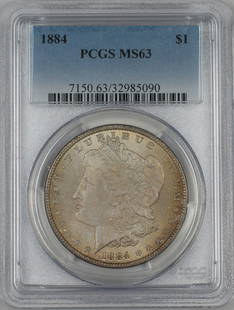 1884 Morgan Silver Dollar PCGS MS-63 Uncirculated Toned Coin: 1884 Morgan Silver Dollar PCGS MS-63 Uncirculated Toned Coin This 1884 Morgan Silver Dollar is a stunning piece graded MS-63 by PCGS, showcasing a beautiful toning that adds to its collectible appeal.
