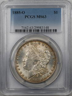 1885-O Morgan Silver Dollar $1 PCGS MS 63 Uncirculated Light Toning: 1885-O Morgan Silver Dollar $1 PCGS MS 63 Uncirculated Light Toning This 1885-O Morgan Silver Dollar is a remarkable piece, certified by PCGS with a grade of MS 63. Minted in New Orleans, this uncircu