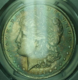 1884-O Morgan Silver Dollar MS 64 PCGS Uncirculated Stunning Toning: 1884-O Morgan Silver Dollar MS 64 PCGS Uncirculated Stunning Toning This stunning 1884-O Morgan Silver Dollar features incredible toning and vibrant colors, making it a captivating addition for collec