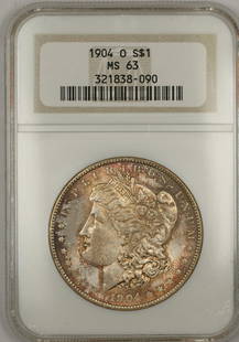 1904-O Morgan Silver Dollar NGC MS 63 Uncirculated Toned Coin: 1904-O Morgan Silver Dollar NGC MS 63 Uncirculated Toned Coin This 1904-O Morgan Silver Dollar is a stunning example of American coinage, graded MS 63 by NGC, ensuring its quality and preservation. St