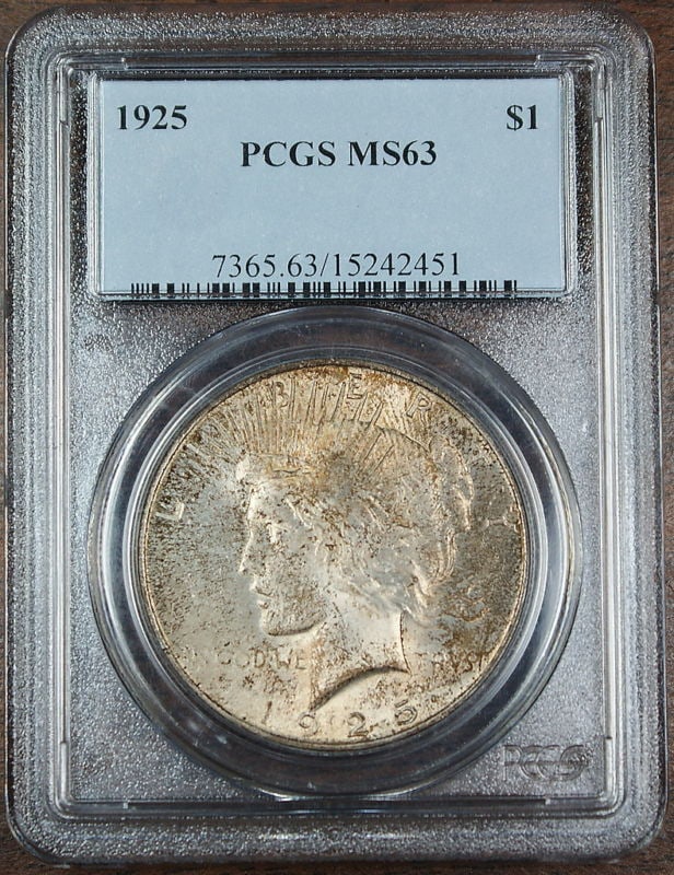 1925 Peace Silver Dollar Coin PCGS MS-63 Uncirculated Toned: 1925 Peace Silver Dollar Coin PCGS MS-63 Uncirculated Toned This stunning 1925 Peace Silver Dollar Coin is graded MS-63 by PCGS, showcasing its uncirculated condition. Minted in Philadelphia, this coi