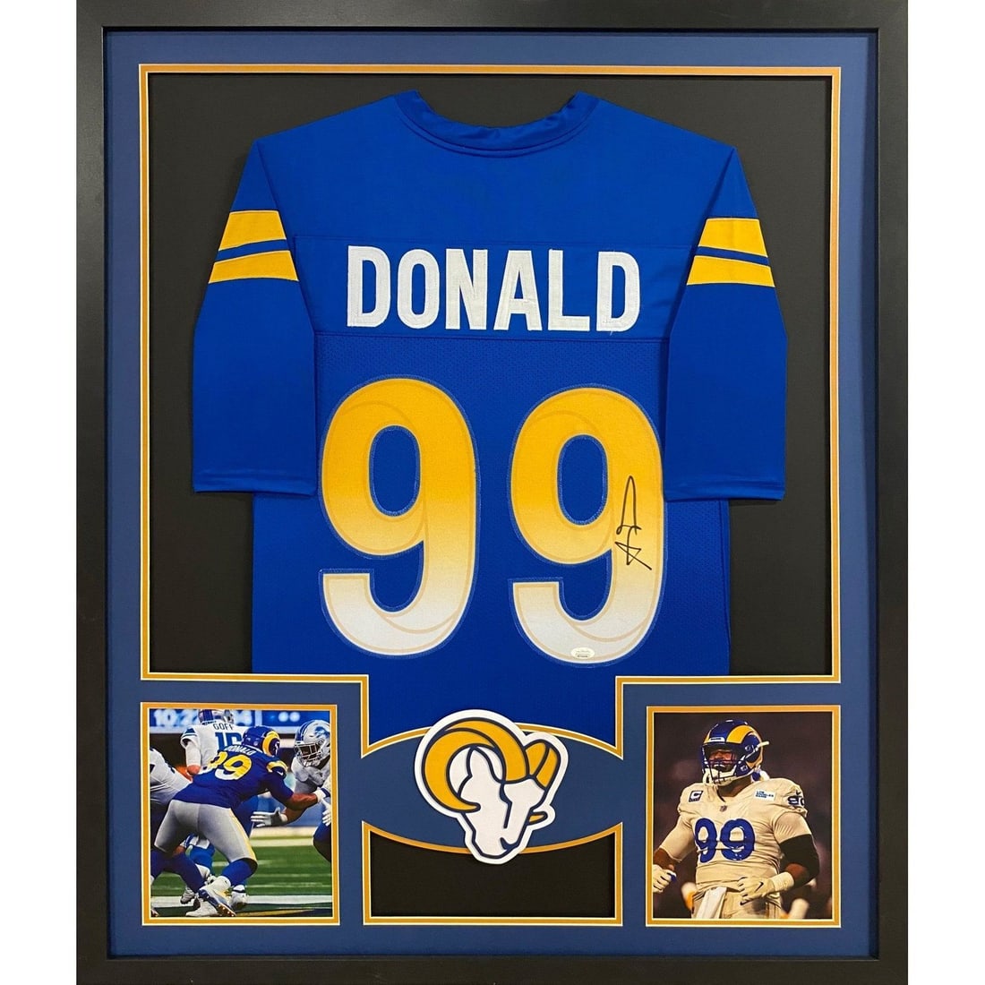 Aaron Donald Signed Rams Jersey Framed JSA Certified 42x34: Aaron Donald Signed Rams Jersey Framed JSA Certified 42x34 This is a beautifully framed autographed jersey of Aaron Donald, showcasing the Los Angeles Rams. The jersey is authenticated by JSA, a leade
