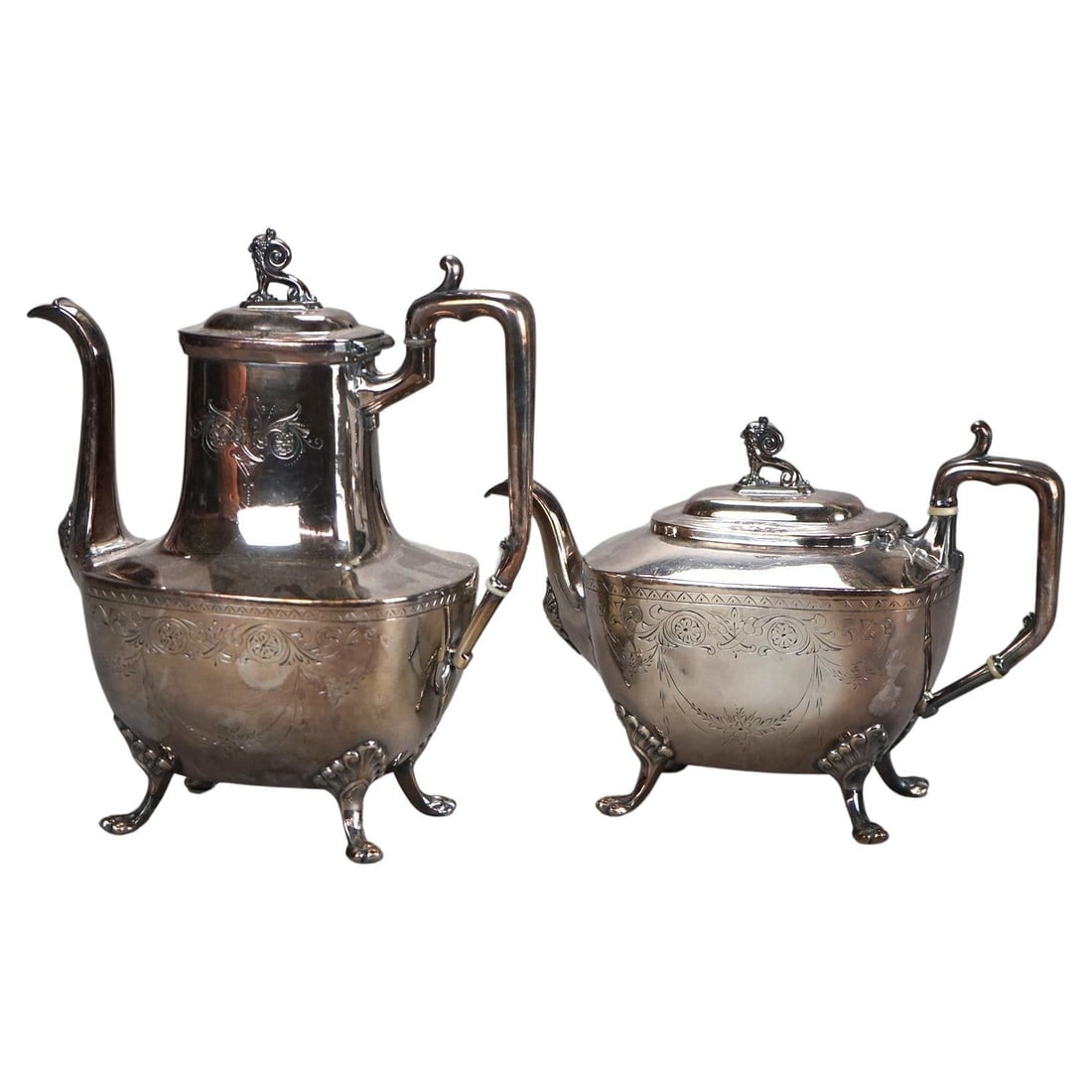 Antique Clawfoot Silver Plated Tea Set C1890 Set of 2: Antique Clawfoot Silver Plated Tea Set C1890 Set of 2 This exquisite two-piece figural tea set, crafted around 1890, showcases a stunning antique clawfoot design. Made of silver plate, this set embodi