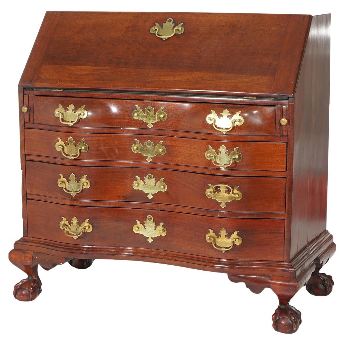 Century Chippendale Mahogany Drop-Front Desk with Brass Pulls: Century Chippendale Mahogany Drop-Front Desk with Brass Pulls This exquisite Chippendale style desk features a serpentine drop-front design crafted from rich mahogany. The desk incorporates four gradu