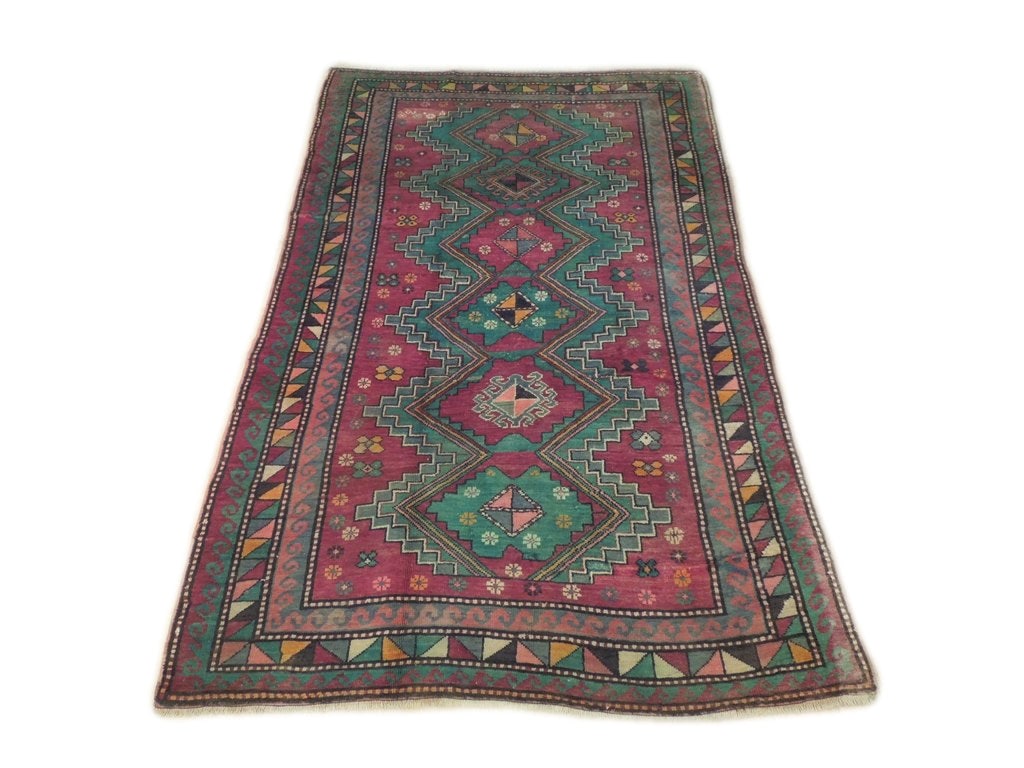 5' x 8' Green Semi-Antique Kazak Runner Handcrafted Wool Rug: 5' x 8' Green Semi-Antique Kazak Runner Handcrafted Wool Rug Elevate your home decor with this exquisite 5' x 8' Green Semi-Antique Russian Kazak Runner. Handcrafted by skilled Persian artisans, this 