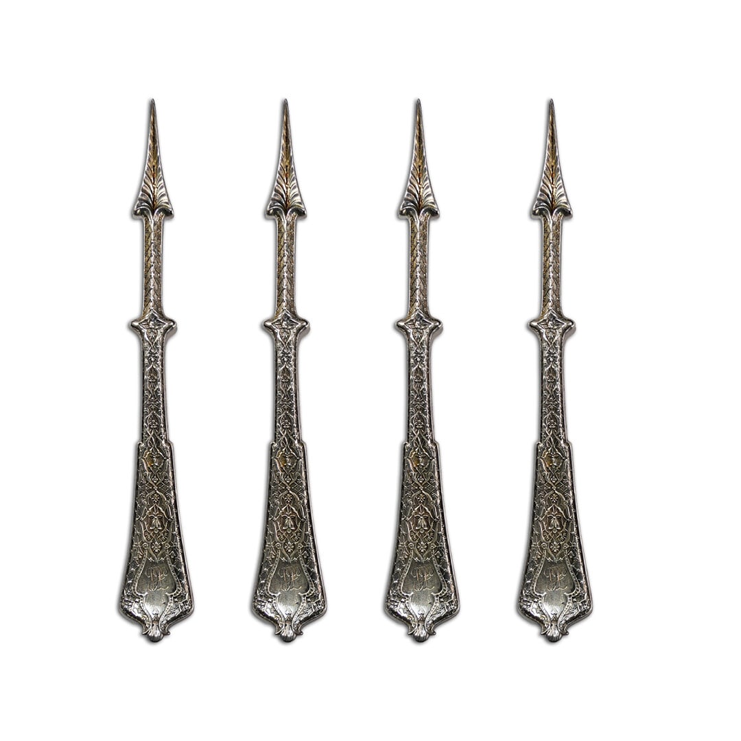 Tiffany & Co. Persian Sterling Silver Nut Picks Set of 4: Tiffany & Co. Persian Sterling Silver Nut Picks Set of 4 This exquisite set of four nut picks from Tiffany & Co. showcases the elegant Persian pattern, crafted in solid sterling silver. Each pick weig