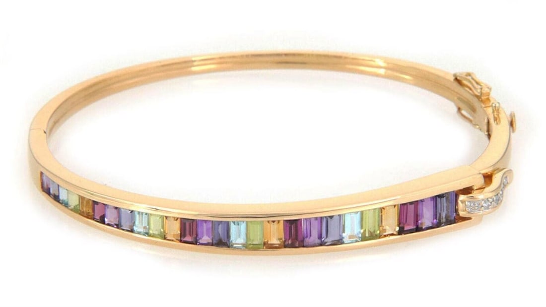 Guy Laroche 18k Yellow Gold Bangle Bracelet with Diamonds and Gemstones: Guy Laroche 18k Yellow Gold Bangle Bracelet with Diamonds and Gemstones Introducing the Guy Laroche Diamond & Gems 18k Yellow Gold Bangle Bracelet, a luxurious piece of fine jewelry that showcases a s