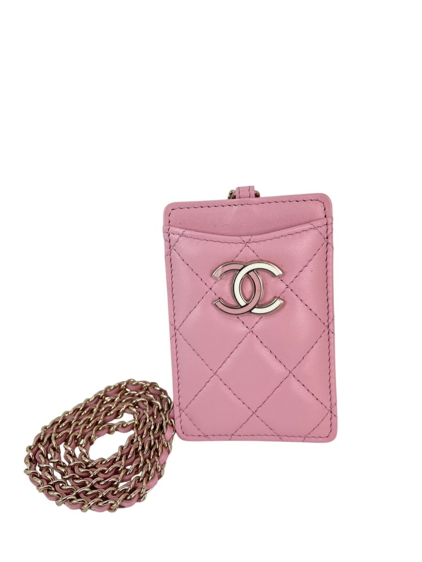 Chanel Pink Lambskin Quilted Card Holder with Chain Strap: Chanel Pink Lambskin Quilted Card Holder with Chain Strap This elegant Chanel Quilted Card Holder on a Chain is crafted from luxurious lambskin leather and features a stylish pink color with an argyle