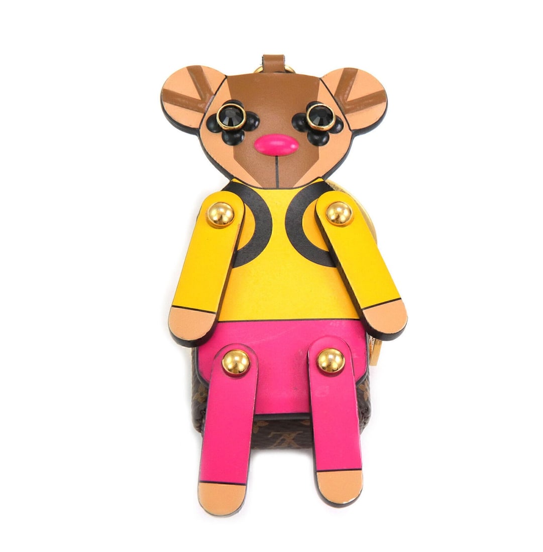 Louis Vuitton Teddy Bear Keychain Charm Pink Yellow Brown Leather: Louis Vuitton Teddy Bear Keychain Charm Pink Yellow Brown Leather Elevate your accessory collection with the Louis Vuitton Teddy Bear Bag Charm Keychain. This whimsical charm features a playful combin