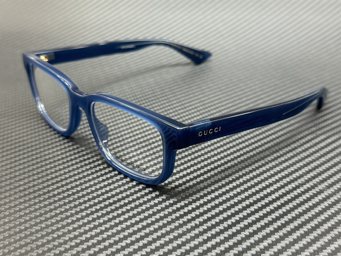 Gucci GG1584O 003 Blue Transparent Men's Eyeglasses with Authenticity Certificate: Gucci GG1584O 003 Blue Transparent Men's Eyeglasses with Authenticity Certificate Discover the elegance of Gucci with these GG1584O 003 eyeglasses, designed for men. These stylish frames feature a str