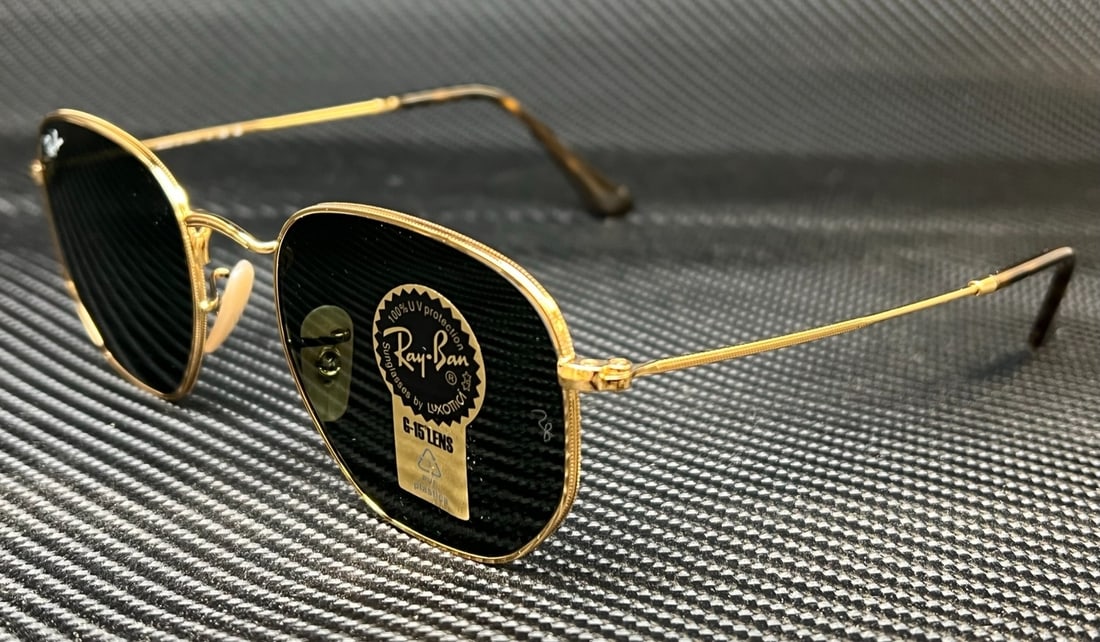 Ray-Ban RB3548N 001 Gold Hexagonal Polarized Sunglasses: Ray-Ban RB3548N 001 Gold Hexagonal Polarized Sunglasses Elevate your style with these Ray-Ban RB3548N 001 Gold Hexagonal Sunglasses. Featuring a striking gold frame and polarized green G-15 lenses, th