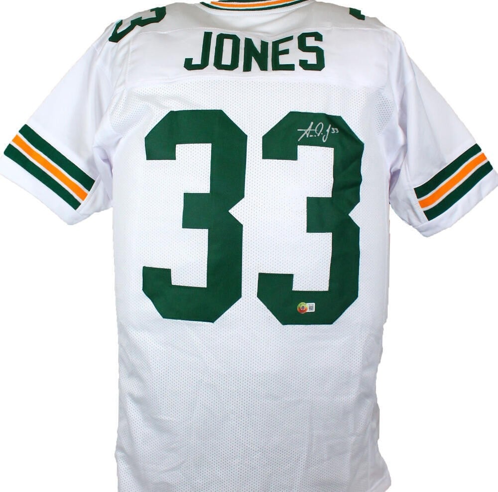 Aaron Jones Autographed Custom White Jersey Beckett Authenticated: Aaron Jones Autographed Custom White Jersey Beckett Authenticated This Aaron Jones Autographed White Pro Style Jersey features a hand autograph from the Green Bay Packers player himself. The jersey is