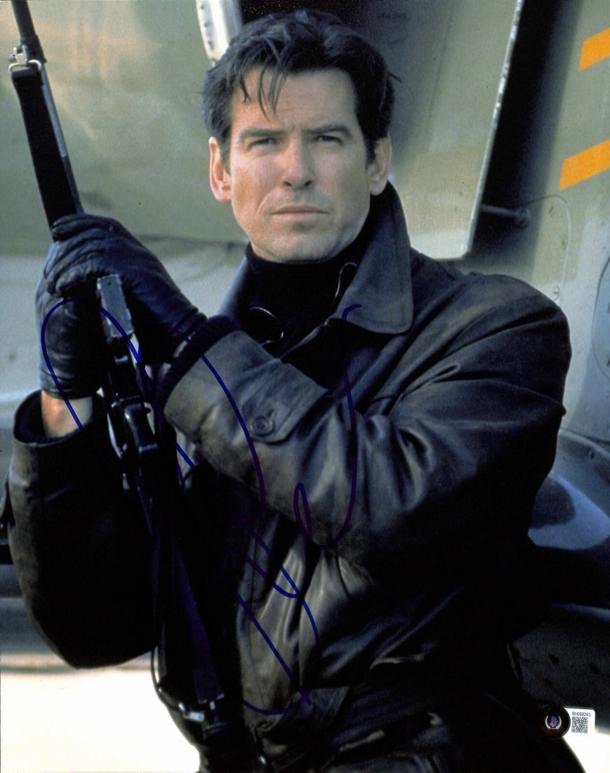Pierce Brosnan Signed 11x14 James Bond Photo with Beckett Certification: Pierce Brosnan Signed 11x14 James Bond Photo with Beckett Certification This striking 11x14 photograph features Pierce Brosnan, renowned for his role as James Bond OO7. The image is autographed in blu