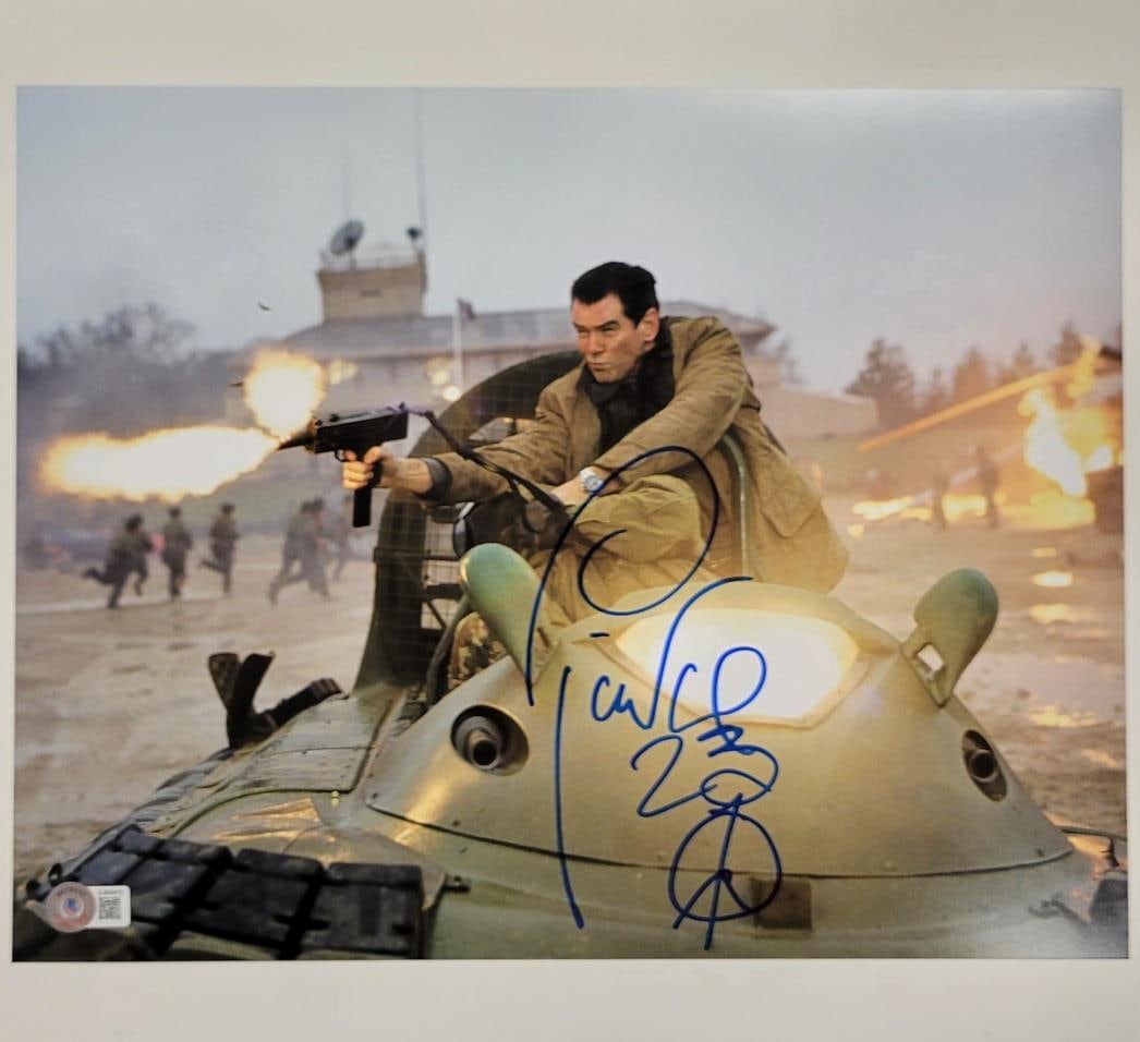 Pierce Brosnan Signed 11x14 Goldeneye Photo Beckett Authenticated: Pierce Brosnan Signed 11x14 Goldeneye Photo Beckett Authenticated Capture a piece of cinematic history with this original 11x14 photograph from the iconic James Bond film "Goldeneye," signed by the le