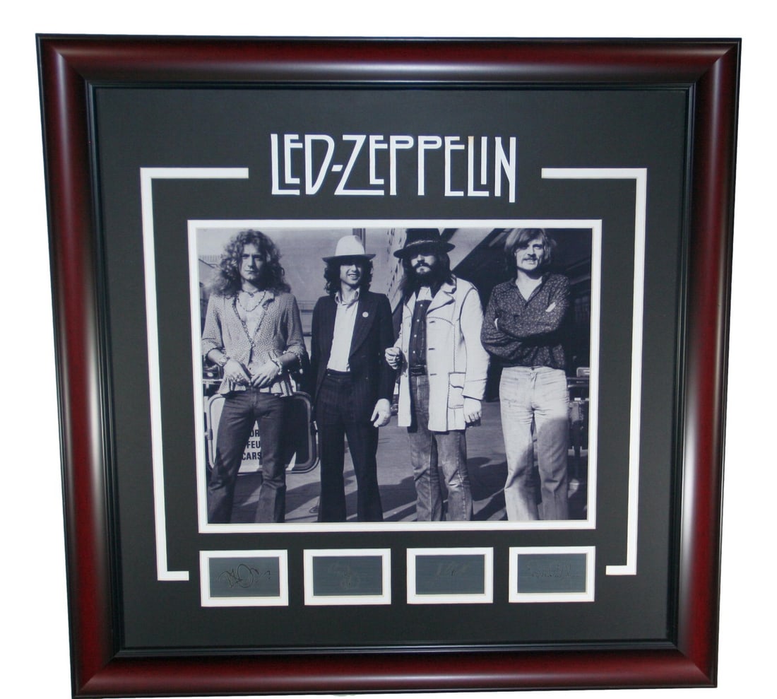 Led Zeppelin 16 x 20 Framed Photo Poster with Etched Autographs: Led Zeppelin 16 x 20 Framed Photo Poster with Etched Autographs This striking framed photograph poster captures the legendary band Led Zeppelin in a classic black and white theme. Measuring 16 x 20 in