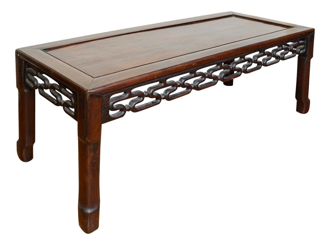 19th Century Chinese Hardwood Low Coffee Table with C-Scroll Carvings: 19th Century Chinese Hardwood Low Coffee Table with C-Scroll Carvings Discover this exquisite 19th Century Chinese hardwood low coffee table or bench, featuring a beautifully paneled top and an intric