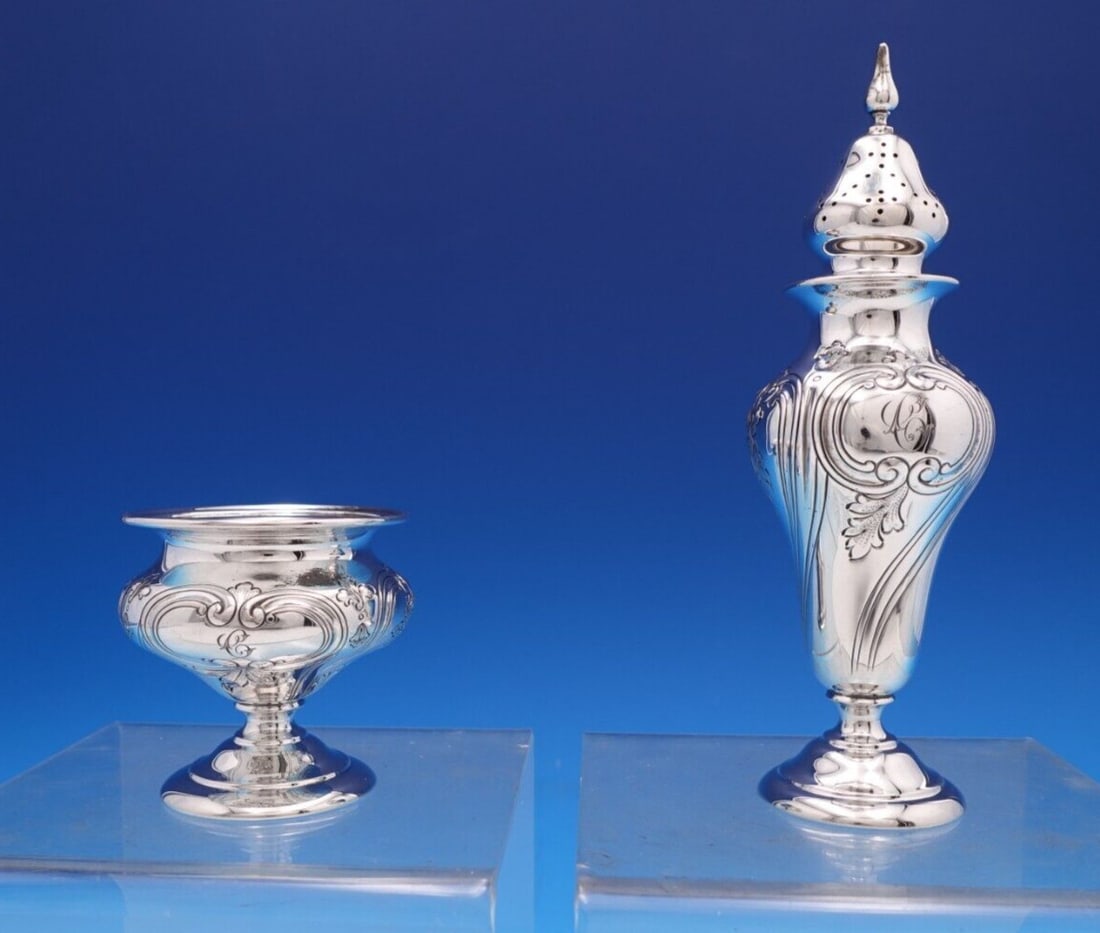 Shreve Floral Sterling Silver Salt Dip and Pepper Shaker Set 2pc: Shreve Floral Sterling Silver Salt Dip and Pepper Shaker Set 2pc Enhance your dining experience with this exquisite two-piece salt dip and pepper shaker set by Shreve, featuring a charming floral patt