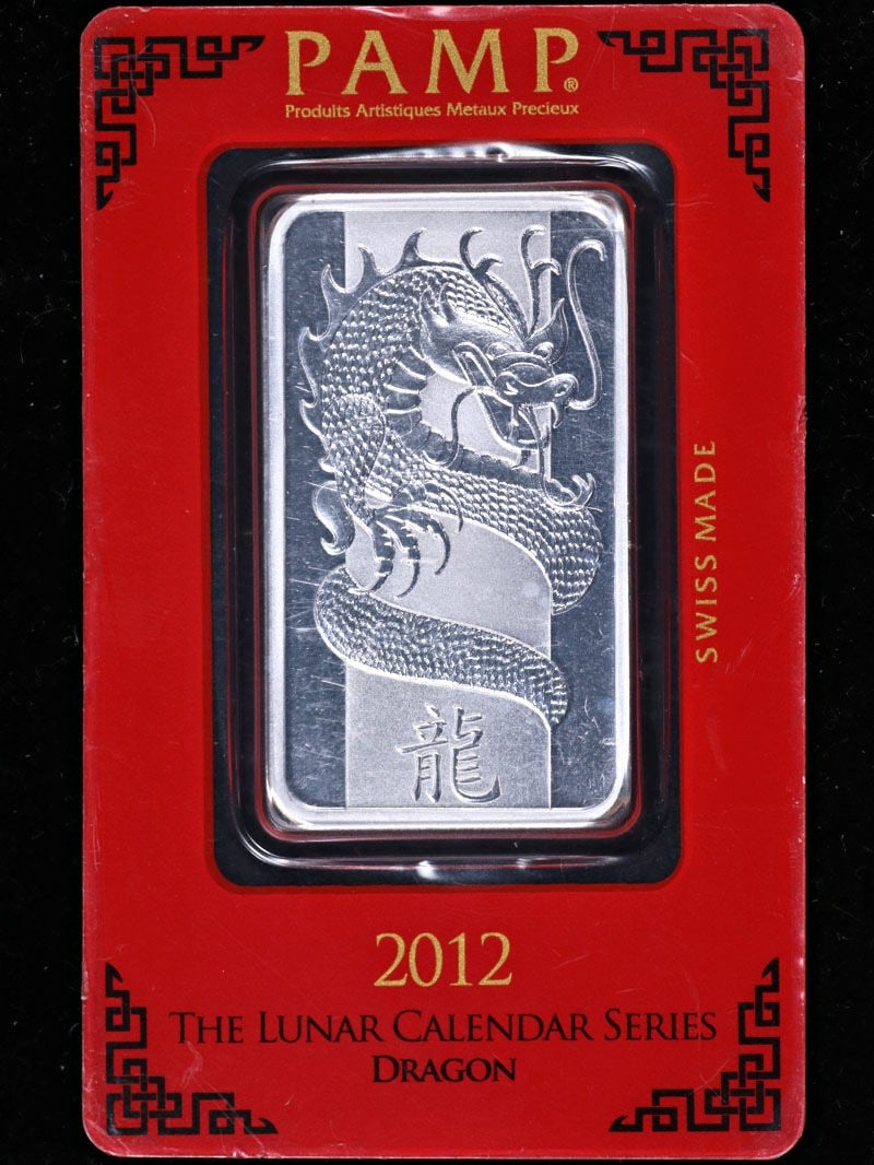 2012 Pamp Suisse 1oz Silver Bar Lunar Calendar Dragon .999 Fine: 2012 Pamp Suisse 1oz Silver Bar Lunar Calendar Dragon .999 Fine Discover the 2012 Pamp Suisse 1 Ounce Silver Bar featuring the exquisite Lunar Calendar Dragon design. This bar is composed of .999 fine