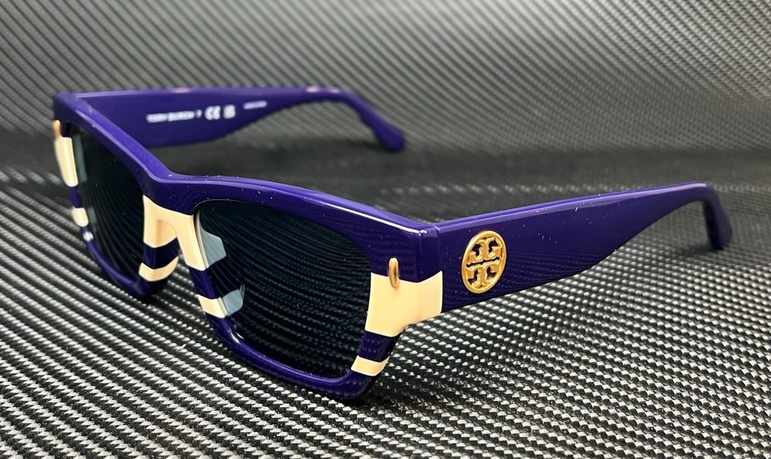 Tory Burch TY7169U 189580 Navy Blue Ivory Women's Sunglasses: Tory Burch TY7169U 189580 Navy Blue Ivory Women's Sunglasses Elevate your accessory game with these Tory Burch TY7169U sunglasses. Designed for women, these stylish rectangular sunglasses feature a ch