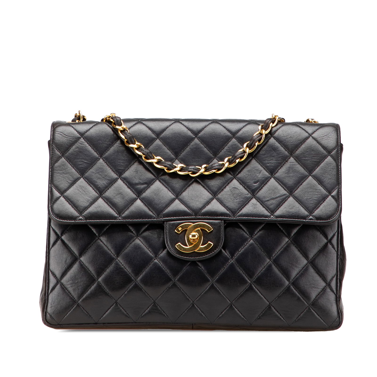 Chanel Jumbo Classic Lambskin Black Flap Bag with Dust Bag: Chanel Jumbo Classic Lambskin Black Flap Bag with Dust Bag Introducing the Chanel Jumbo Classic Lambskin Single Flap, a timeless shoulder bag crafted from luxurious quilted lambskin leather. This exqu