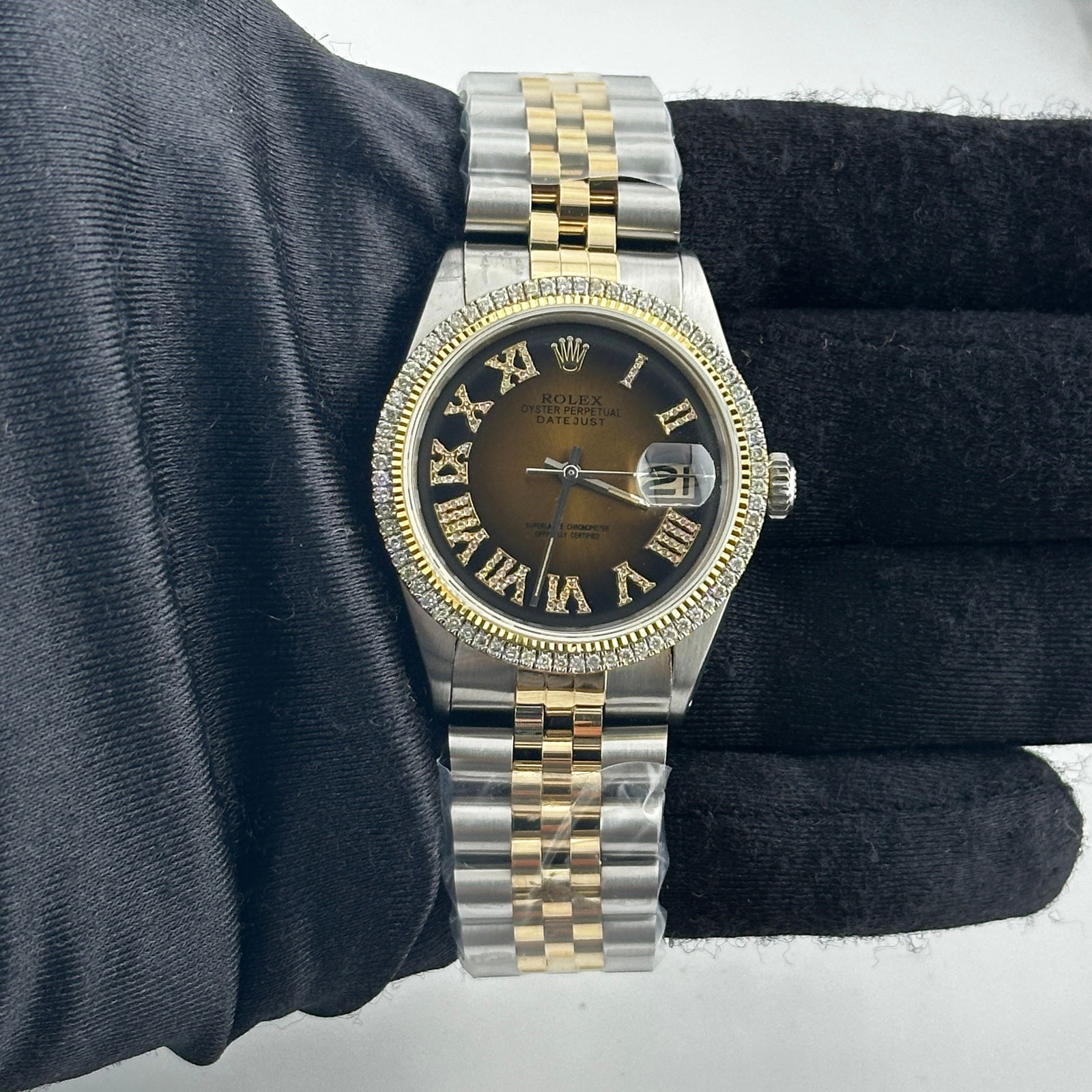 Rolex Datejust 1601 Brown Black Roman Dial Diamond Bezel AM Jubilee: Rolex Datejust 1601 Brown Black Roman Dial Diamond Bezel AM Jubilee This stunning Rolex Datejust features a striking Brown & Black Roman dial complemented by a prong plated diamond bezel. Designed for