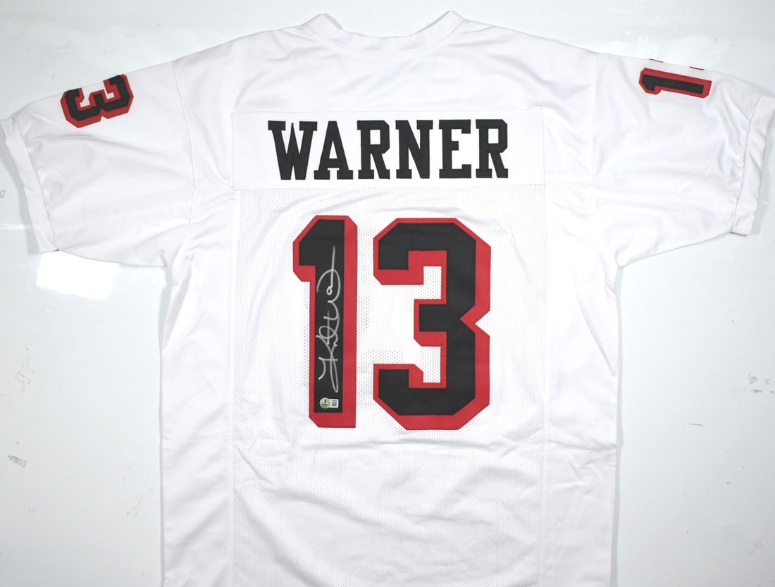 Kurt Warner Autographed Iowa Barnstormers Jersey Beckett Authenticated: Kurt Warner Autographed Iowa Barnstormers Jersey Beckett Authenticated This is an original white pro style jersey autographed by Kurt Warner, showcasing his signature on a piece that pays tribute to h