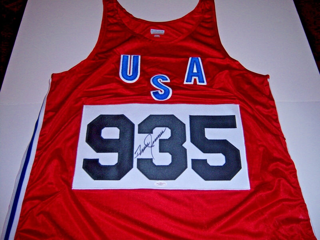 Bruce Jenner Signed Olympic Decathlon Jersey JSA COA: Bruce Jenner Signed Olympic Decathlon Jersey JSA COA Celebrate Olympic history with this original Bruce Jenner signed jersey, commemorating his iconic gold medal performance in the decathlon. This pre