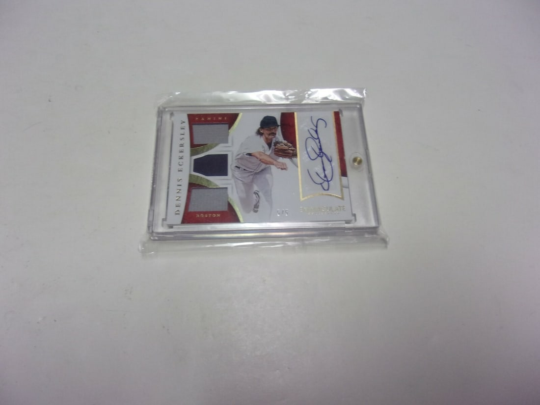 Dennis Eckersley 2015 Panini Game Used Triple Jersey Auto 5/5: Dennis Eckersley 2015 Panini Game Used Triple Jersey Auto 5/5 This is a rare 2015 Panini game-used triple jersey relic autographed card featuring Dennis Eckersley, a legendary MLB pitcher. This origin
