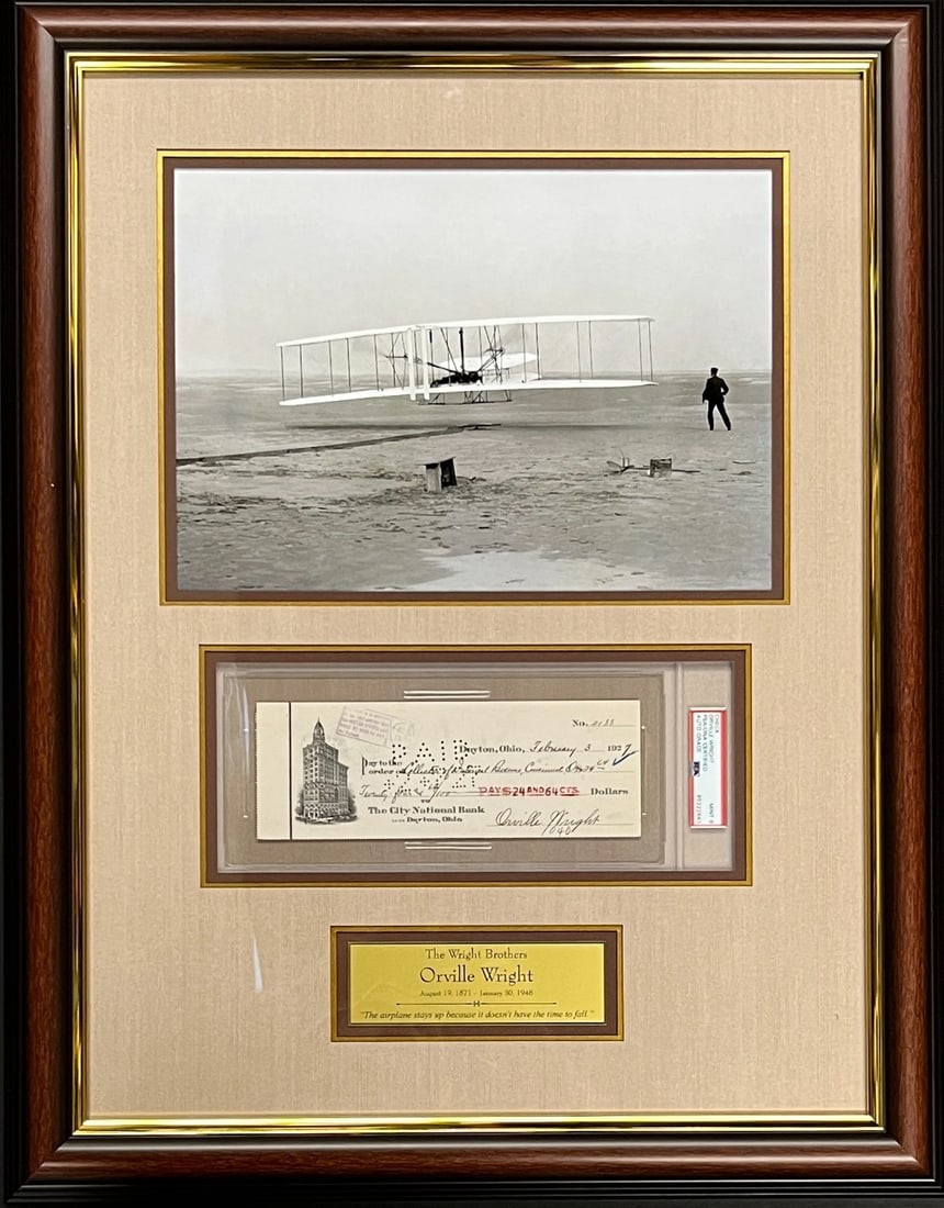 Orville Wright Signed Check Custom Framed PSA 9 Display: Orville Wright Signed Check Custom Framed PSA 9 Display This custom framed display features a personal bank check signed by Orville Wright, the esteemed inventor of the airplane. The check is authenti
