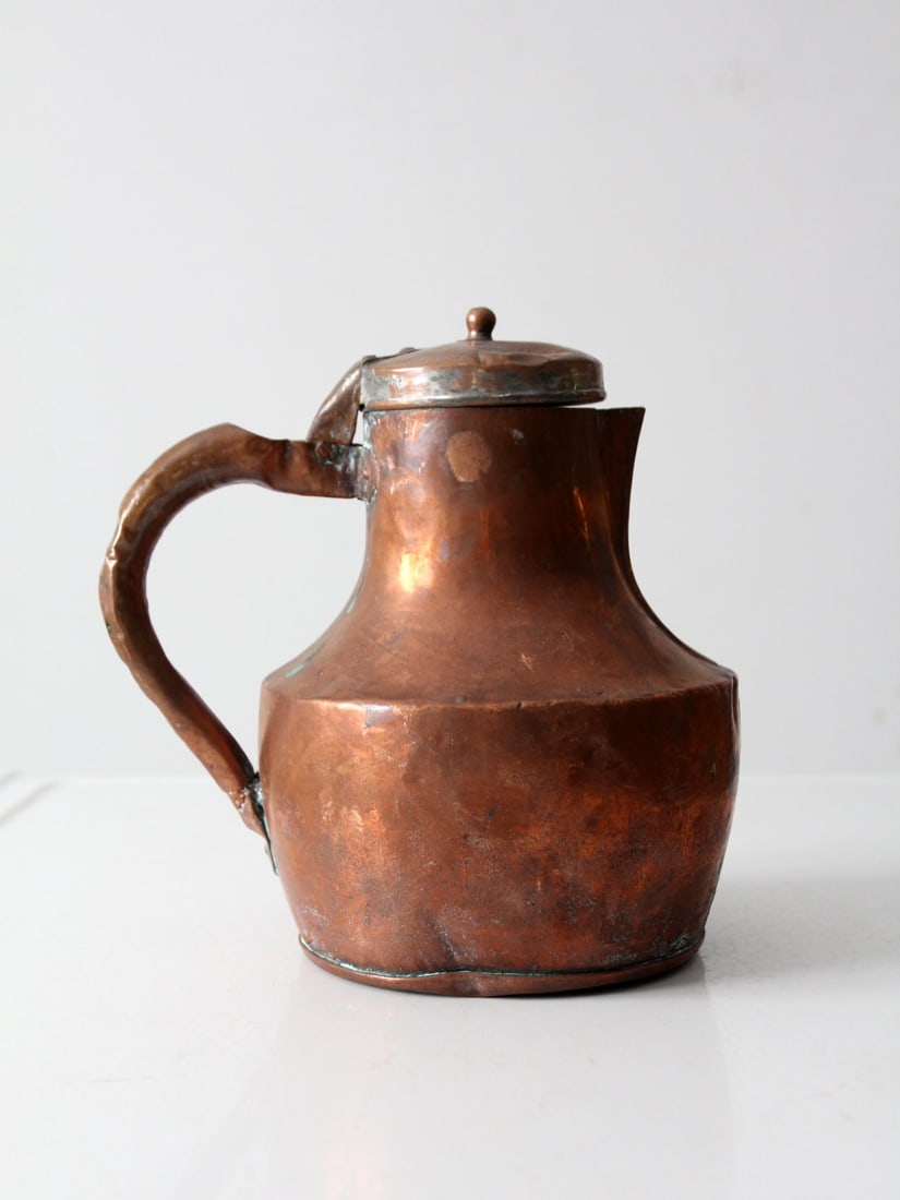 19th Century French Antique Copper Pitcher Lidded Ewer: 19th Century French Antique Copper Pitcher Lidded Ewer This exquisite 19th century French antique copper pitcher is a timeless beauty, marked "22". It features a graceful, short-spouted design complem