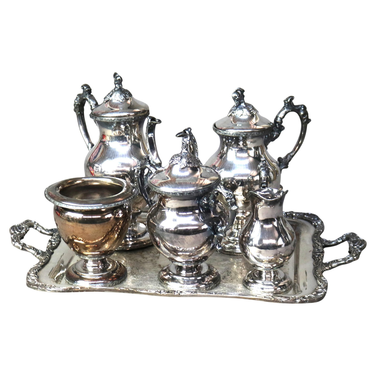 Victorian Silver Plate Tea Set C1890 6 Pieces with Tray and Pitchers: Victorian Silver Plate Tea Set C1890 6 Pieces with Tray and Pitchers Enhance your tea time with this exquisite six-piece Antique Victorian Silver Plate Tea Set, dating back to c1890. This elegant set 