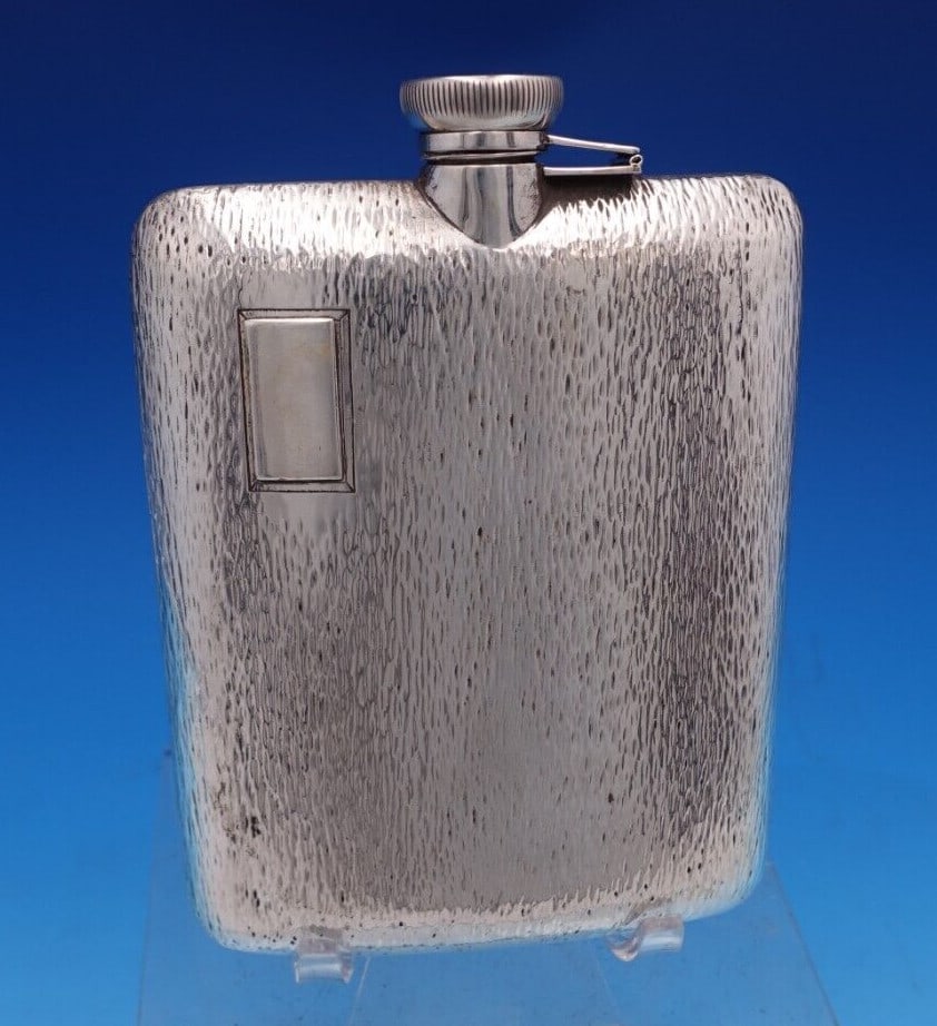 Sterling Silver Flask Bark Design 7/16 Pint 5 3/4 x 4: Sterling Silver Flask Bark Design 7/16 Pint 5 3/4 x 4 This exquisite sterling silver flask showcases a stunning bark design, making it a perfect blend of functionality and artistry. With a capacity of
