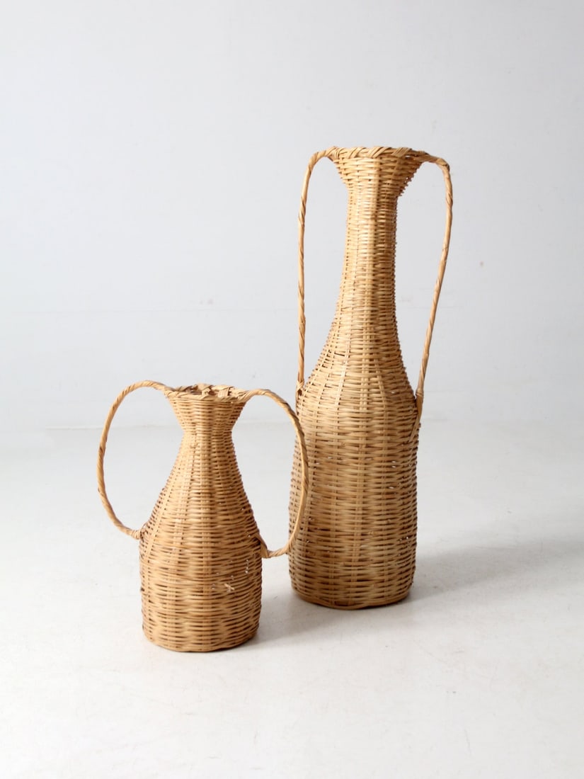 Classic Vintage Rattan Amphora Baskets Pair Handwoven Storage: Classic Vintage Rattan Amphora Baskets Pair Handwoven Storage Enhance your living space with this exquisite pair of vintage rattan amphora baskets. Expertly handwoven, these baskets feature a classic