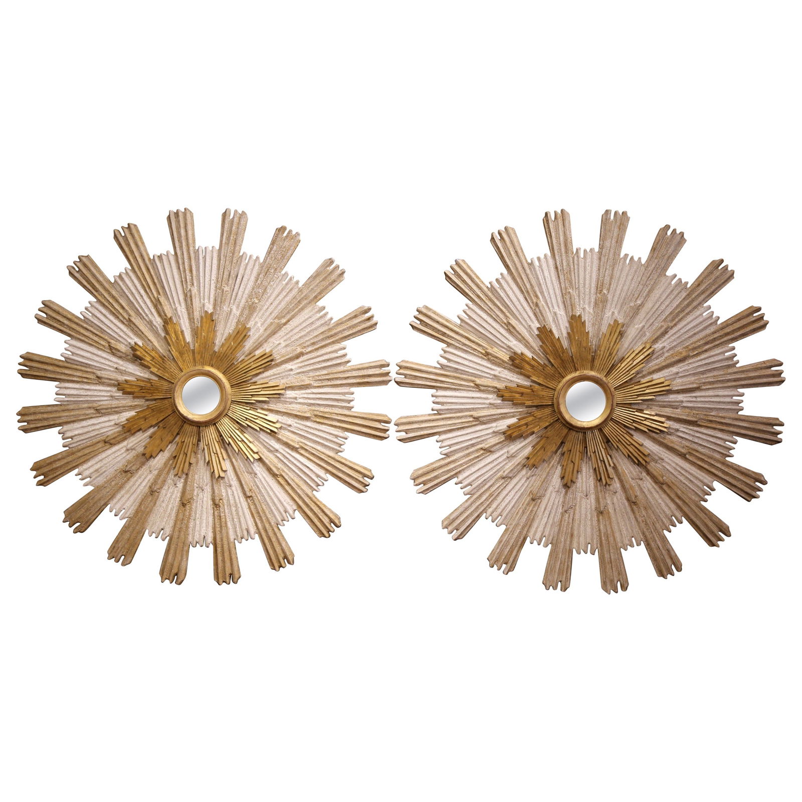 Vintage Italian Giltwood Sunburst Mirrors Set of 2 62.75 Diameter: Vintage Italian Giltwood Sunburst Mirrors Set of 2 62.75 Diameter Elevate your home decor with this stunning pair of vintage Italian carved giltwood sunburst mirrors. Crafted in Italy circa 2010, each