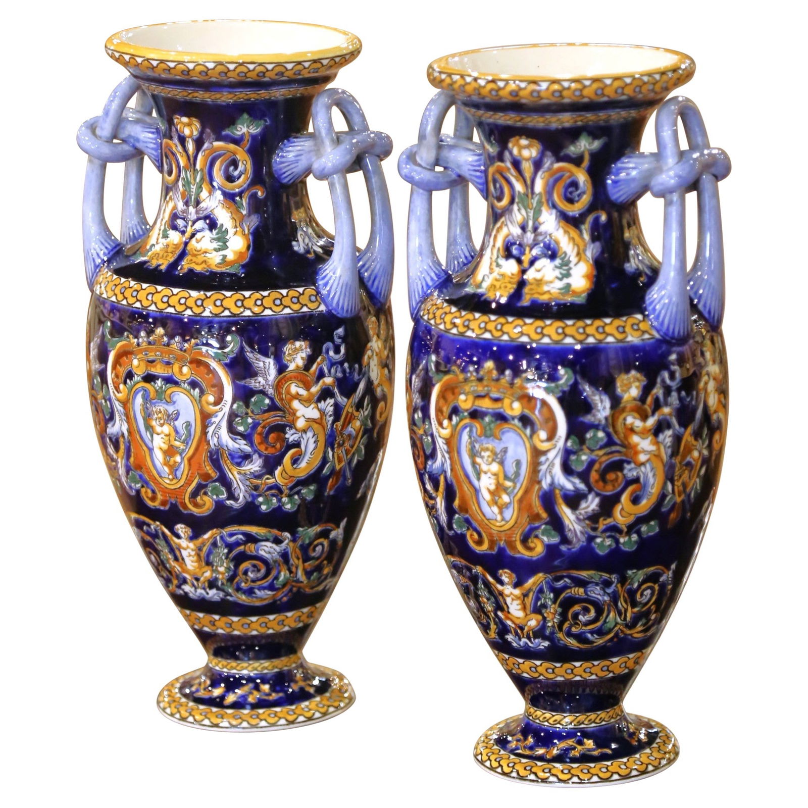 Set of 2 Gien Hand-Painted Faience Vases with Cherubs 1920s: Set of 2 Gien Hand-Painted Faience Vases with Cherubs 1920s This exquisite pair of early 20th-century faience vases, crafted by the renowned Faiencerie de Gien in France circa 1920, showcases the eleg