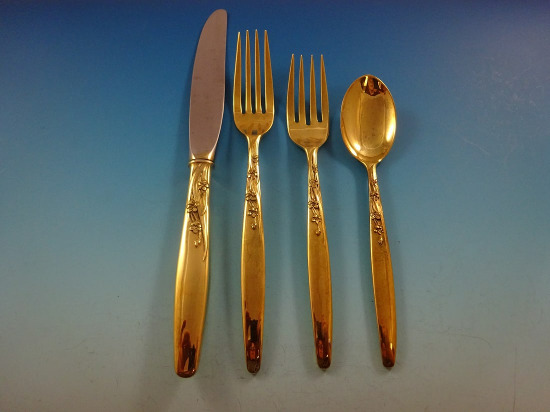 Lunt Summer Song Gold Vermeil Sterling Silver Flatware Service for 12 with Storage Chest: Lunt Summer Song Gold Vermeil Sterling Silver Flatware Service for 12 with Storage Chest Elevate your dining experience with the exquisite Summer Song Gold flatware service for 12, crafted by Lunt. Th