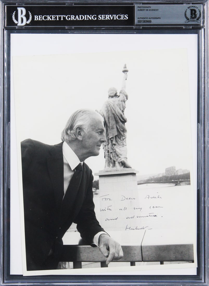 Hubert De Givenchy Signed 8x10 Photo with Inscription Beckett Authenticated: Hubert De Givenchy Signed 8x10 Photo with Inscription Beckett Authenticated This is an authentic 8x10 black and white photo personally signed by renowned designer Hubert De Givenchy. The photo feature