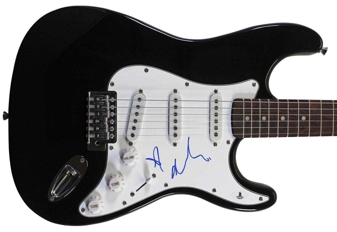 Adele Signed Black Huntington Pro Electric Guitar Beckett COA: Adele Signed Black Huntington Pro Electric Guitar Beckett COA This authentic black Huntington Pro electric guitar has been personally signed by the renowned artist Adele. The guitar comes with a Certi