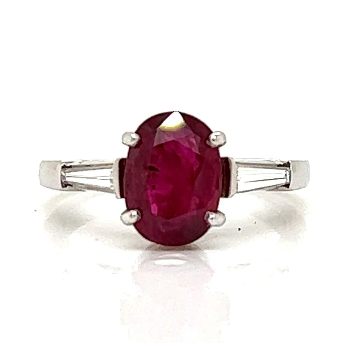 Stunning Platinum GIA Certified 2.20 Ct Ruby Diamond Ring: Stunning Platinum GIA Certified 2.20 Ct Ruby Diamond Ring This stunning Platinum ring showcases a remarkable 2.20 Ct. GIA Certified Ruby at its center, measuring 9.20 x 6.68 x 3.85 mm. The ring is fur