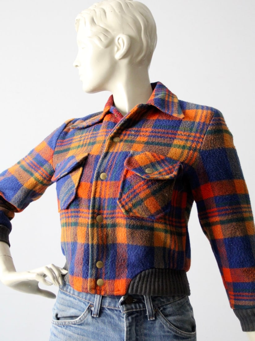 Vintage Wool Bomber Jacket Blue Orange Plaid with Green Accents: Vintage Wool Bomber Jacket Blue Orange Plaid with Green Accents This vintage plaid wool bomber jacket showcases a striking blue and orange plaid design, complemented by a forest green ribbed knit wais